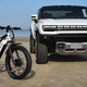 A photo of a Hummer Ev and a Hummer E-Bike.